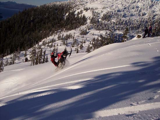 Snowmobile mountain climb