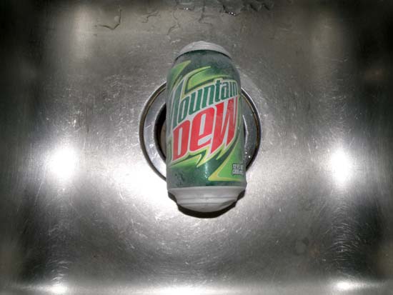 Frozen, bulged can of Mountain Dew