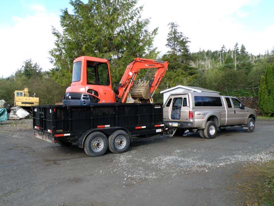 Kubota track hoe loaded in the trailer.