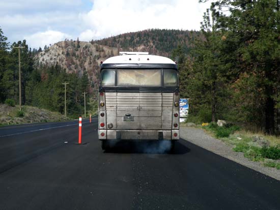 The back end of a very polluting bus.