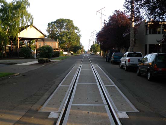 Railway tracks down the middle of the road.