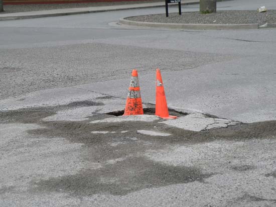 Cones in a pothole.